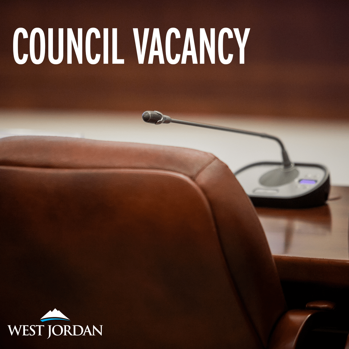 An empty leather chair with a microphone on the table in front of it. Text reads Council Vacancy at the top and West Jordan with a mountain logo at the bottom.