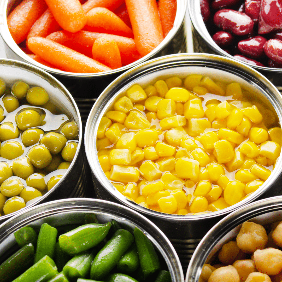 image of bright vegetables in aluminum cans