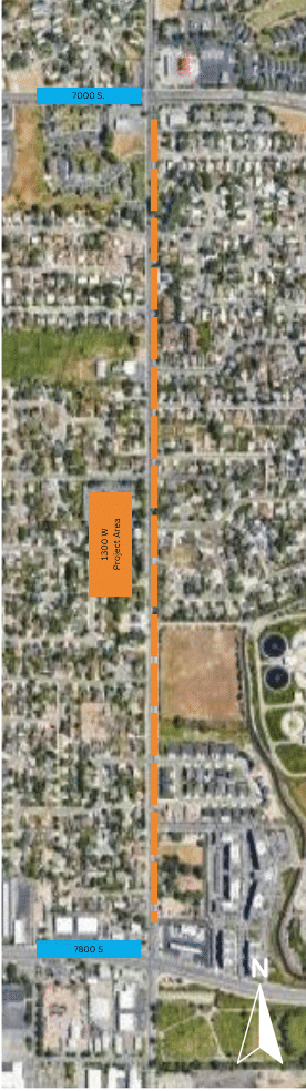 Aerial view of a neighborhood showing a highlighted area labelled Project Area along a north-south road. The top is marked 7000 S and the bottom is 7800 S. Surrounding areas feature residential and industrial spaces, with a compass in the corner.